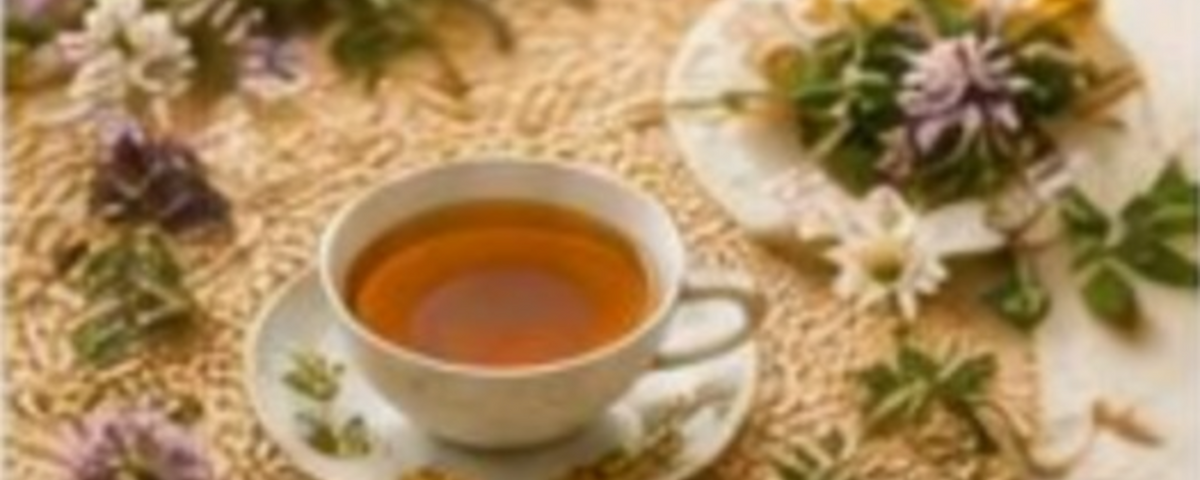 Herbal tea surrounded by fresh flowers